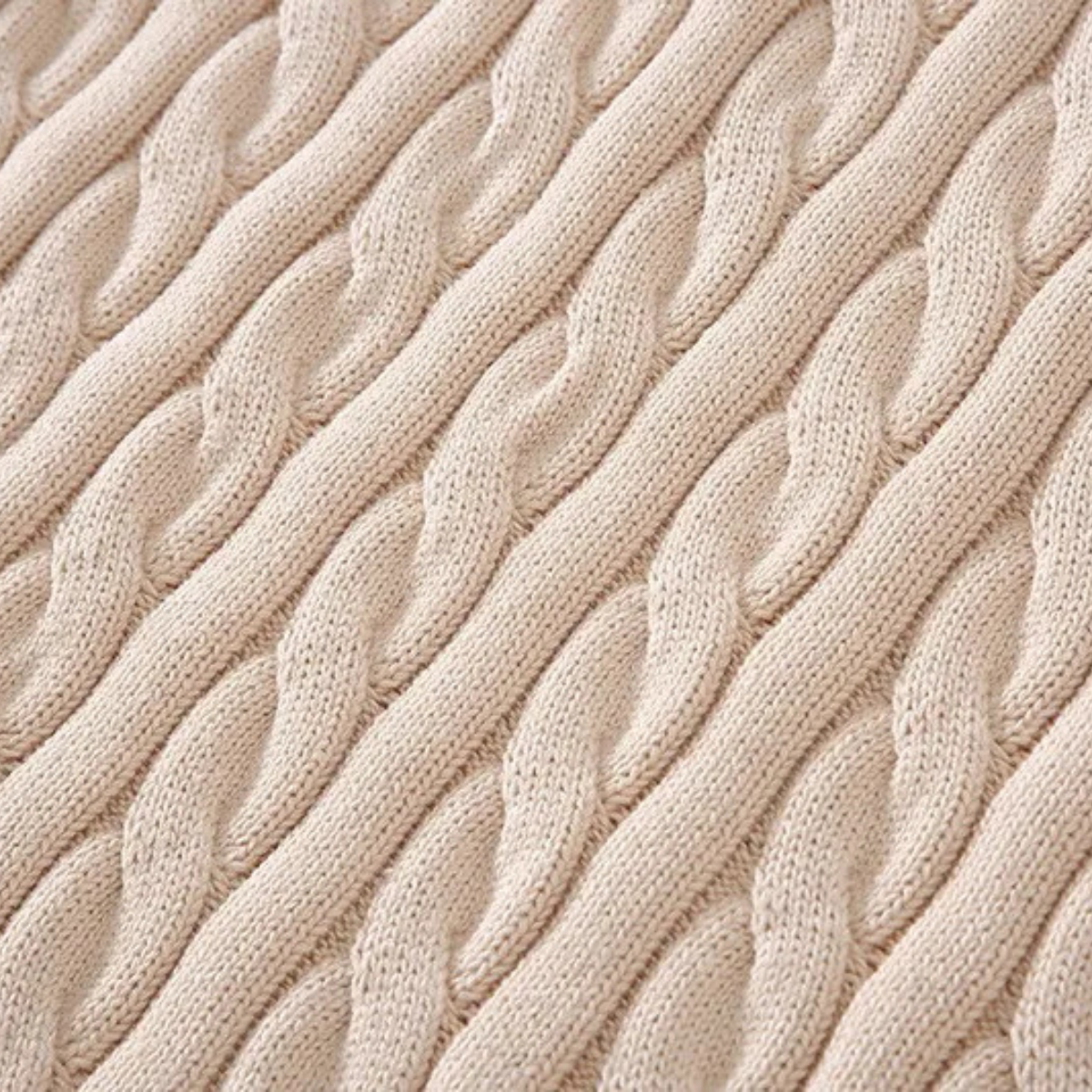 Man wearing a cable knit half zip sweater