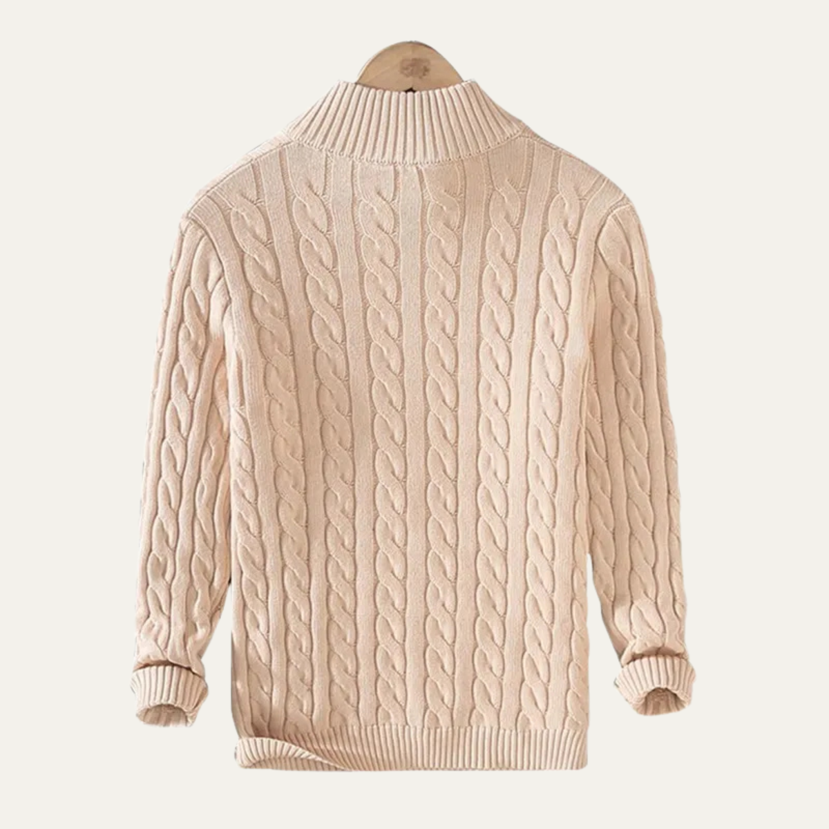 Man wearing a cable knit half zip sweater