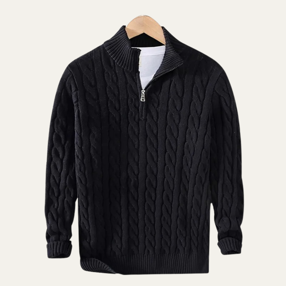 Man wearing a cable knit half zip sweater