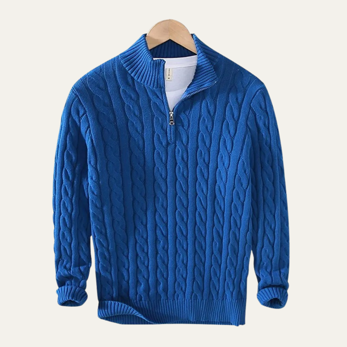 Man wearing a cable knit half zip sweater