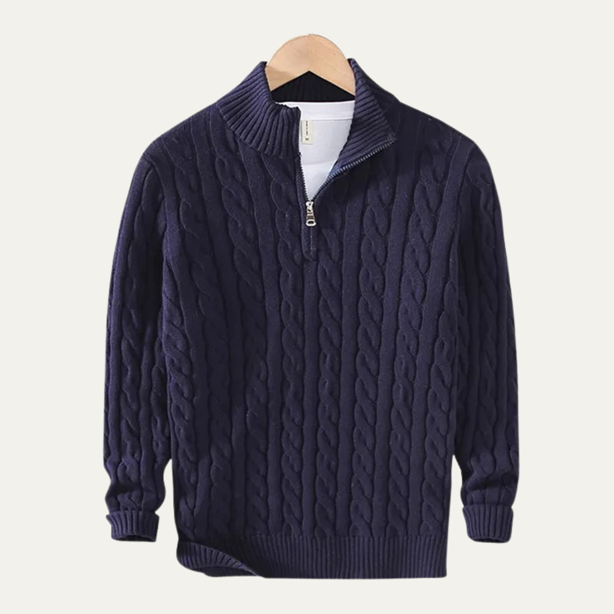 Man wearing a cable knit half zip sweater